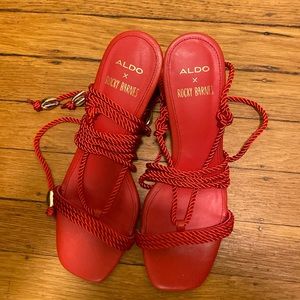 Aldo x Rocky Barnes red strappy heels.